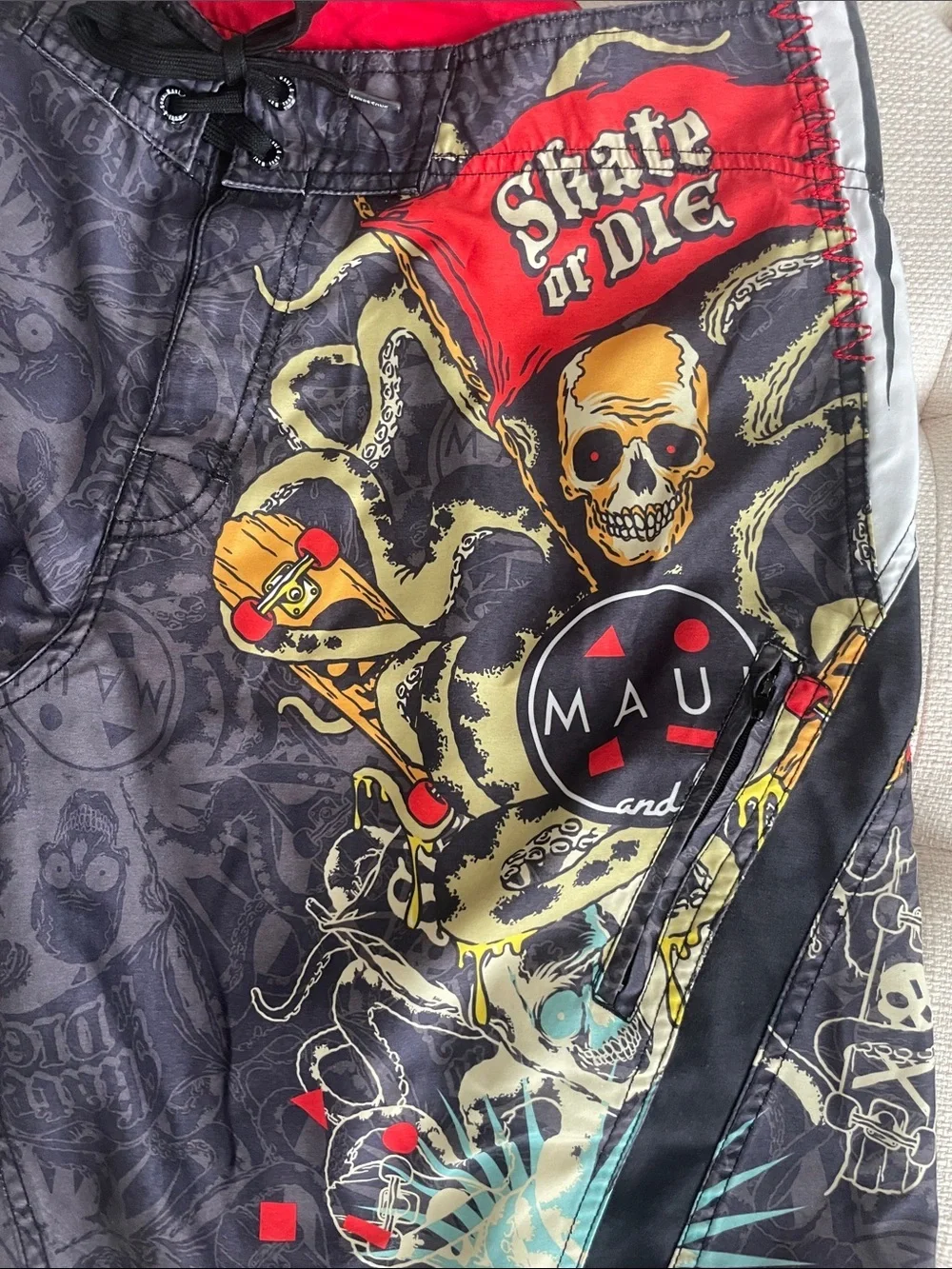 Maui and Sons Black Swim Shorts with Red & Yellow Skull Graphic